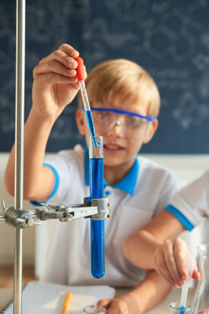 istock child holding pipette|770+ Pipette Boy Stock Photos, Pictures & Royalty.